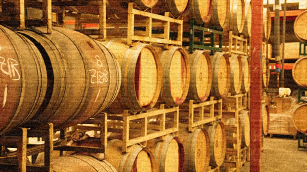 wine-barrels-on-industrial-shelf-in-cellar